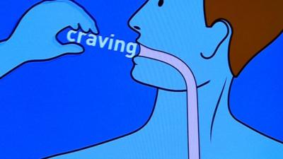 Cartoon of someone eating word 'craving'