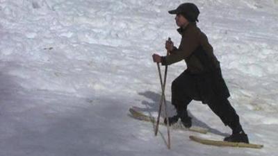 Boy on homemade skis