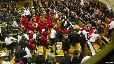 Members of the Economic Freedom Fighters (EFF) clash with security forces