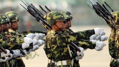 Myanmar soldiers take part in a military parade marking the 65th Armed Forces Day in Nay Pyi Daw on 27 March 2010