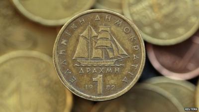 A drachma coin is seen on display in this photo illustration taken in Athens in this May 9, 2012 file photo