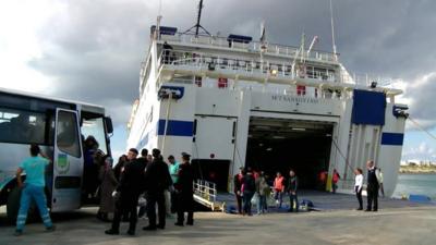 New EU migrants being moved from Lampedusa by ferry to other parts of Italy