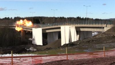 An explosion on a bridge which is being demolished