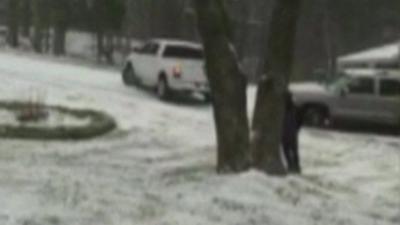 The truck skidding on the ice into another vehicle