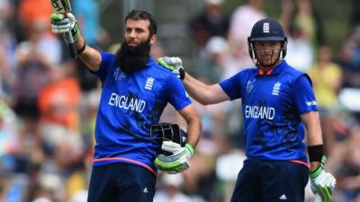 England batsmen Moeen Ali and Ian Bell celebrate during their World Cup match against Scotland