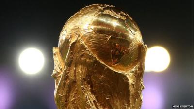 Close up of World Cup trophy (held up by member of winning German team in Brazil World Cup 2014)
