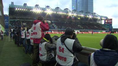 Photographers at football match