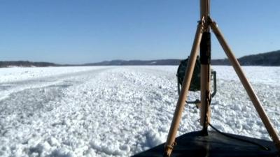 View from a boat of the frozen Hudson river