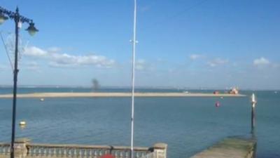 The explosion being carried out on the breakwater off the coast of Cowes