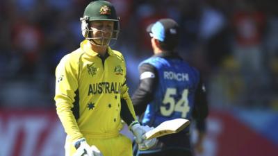 Australia's Michael Clarke reacts after losing his wicket against New Zealand at the Cricket World Cup