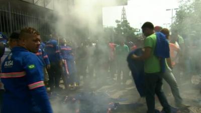 Petrobras workers burn their uniforms