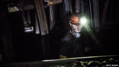 A coal miner works over 3,600 feet below the surface of the earth at Scheglovka Glubokaya mine on March 3, 2015 in Makeevka, Ukraine.