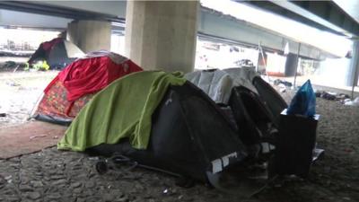 Tents pitched under a London motorway
