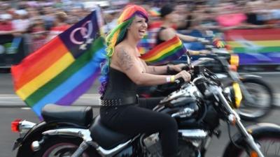 A womand on a motorbike