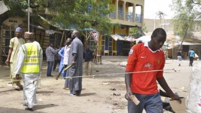 People at the scene of the explosion at the market