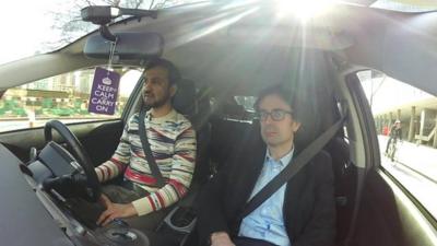 Uber taxi driver Riz and the BBC's Robert Peston