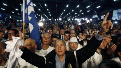 Likud party supporters listen to Israeli Prime Minister Benjamin Netanyahu deliver a speech in Tel Aviv March 18, 2015