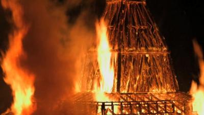 Wooden temple in flames