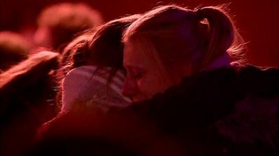 Students outside church vigil