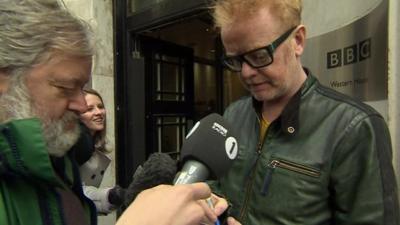 Chris Evans talking to reporter