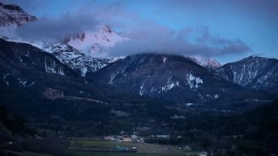 Night falls on the alps near the area where a Germanwings flight crashed