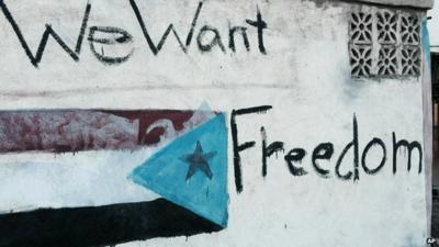 Graffiti depicting the old South Yemen flag