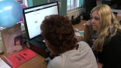 A woman with learning disabilities registering to vote