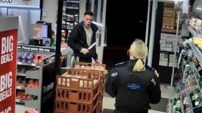 James Lewis wielding a knife at a PCSO officer during the attempted robbery