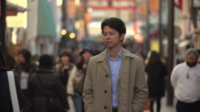 Japanese man in crowded street