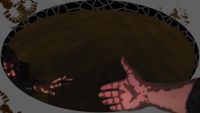 Hand reaching out to a person in a vat of chocolate