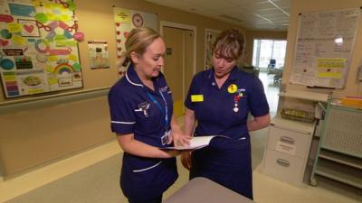 Nurses in Manchester reviewing the new code of conduct handbook