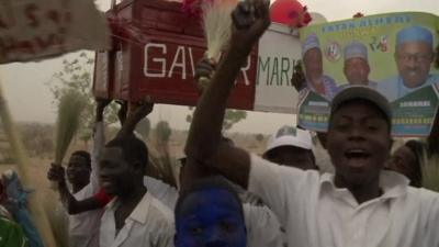 Gen. Buhari supporters holding a coffin symbolising the death of the previous government.