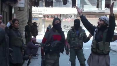 IS militants showing their victory in Yarmouk.