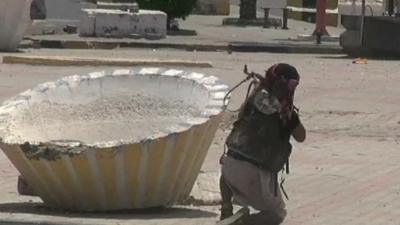 Man holding gun in Aden