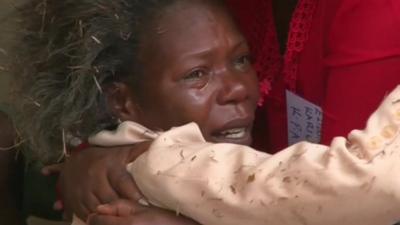 Relative of Garissa University victim crying as she is comforted by another woman