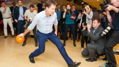 Nick Clegg takes part in ten-pin bowling during a General Election campaign visit to Colchester, Essex