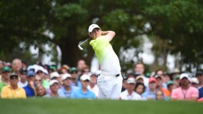 McIlroy plays his tee shot at the fourth on Sunday