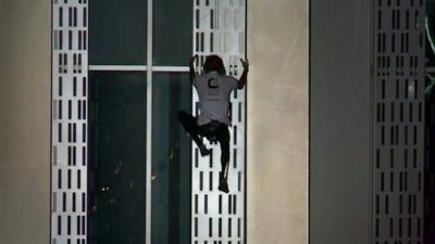 Alain Robert climbing Dubai's Cayan Tower