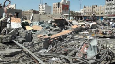Damaged buildings and debris in Aden, Yemen following Saudi air strikes
