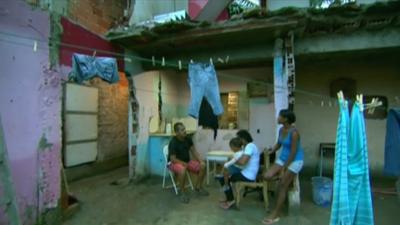 One of the families fighting eviction from Vila Autódromo in the ruins of a house