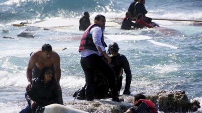 Greek coastguard and locals help to rescue migrants