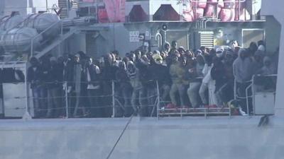 Migrants on a coastguard ship