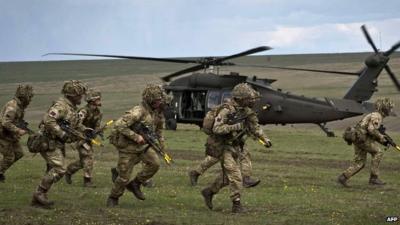 British soldiers take up positions in a military exercise