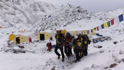 An injured person being carried by rescue team