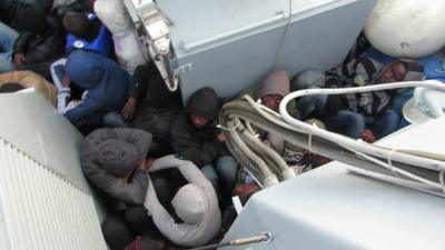 Migrants on board a boat