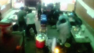 People rush for exit of Chinese restaurant in Nepal