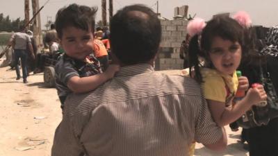 Children carried by their father