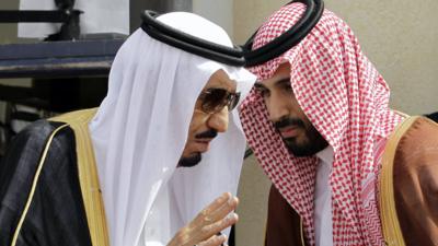 In this May 14, 2012 file photo, then Crown Prince Salman bin Abdul-Aziz Al Saud, left, speaks with his son Prince Mohammed as they wait for Gulf Arab leaders ahead of the opening of Gulf Cooperation Council, also known as GCC summit, in Riyadh, Saudi Arabia