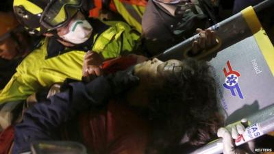 Earthquake survivor Krishna Kumari Khadka on a stretcher after being rescued from collapsed building in Kathmandu