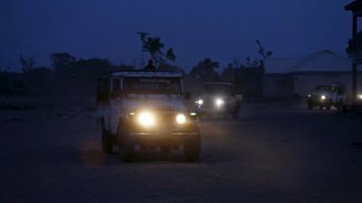 Jeeps bring people to a refugee camp in north-eastern Nigeria